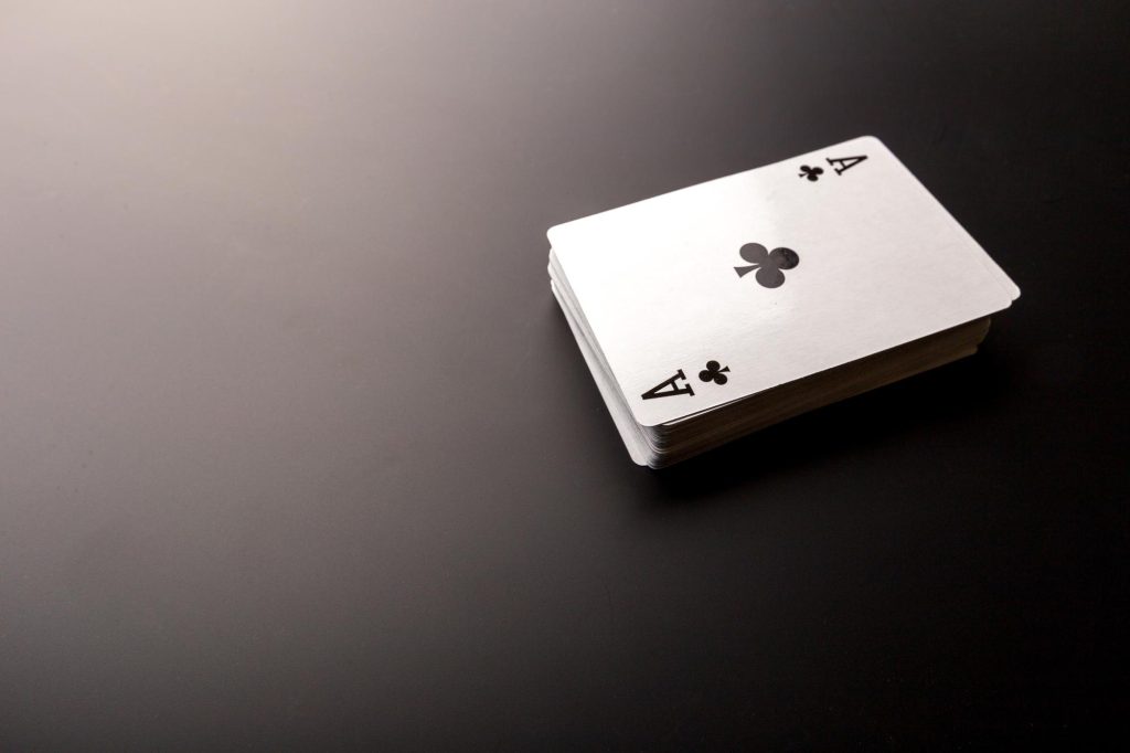poker-chips-and-cards-on-black-background